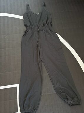 Fashion Nova Black Sleeveless Drawstring Jumpsuit with Elastic Cuffs